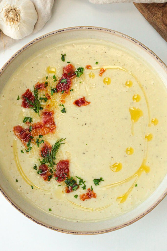 easy roasted garlic soup with bacon bits and cheddar