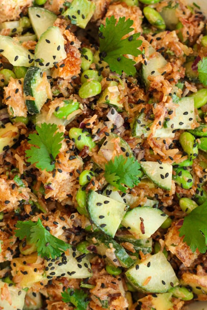 Colorful crispy rice salad with greens and grains
