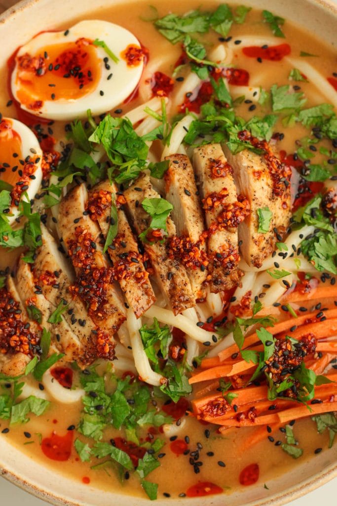 Chicken udon ramen with toppings.