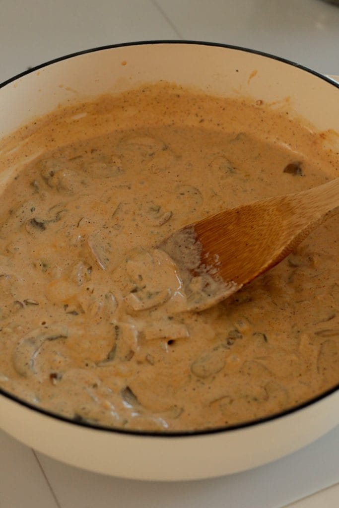 creamy mushroom bacon sauce in a pan