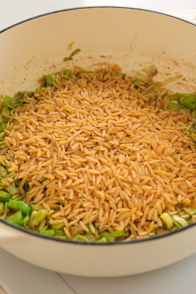 leek and orzo in a pan