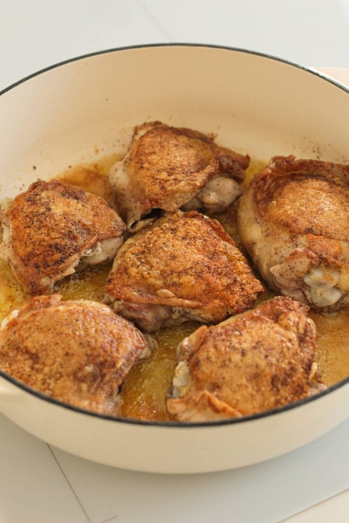 crispy chicken thighs in a pan