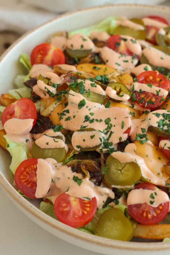 loaded cheeseburger in a bowl with veggies