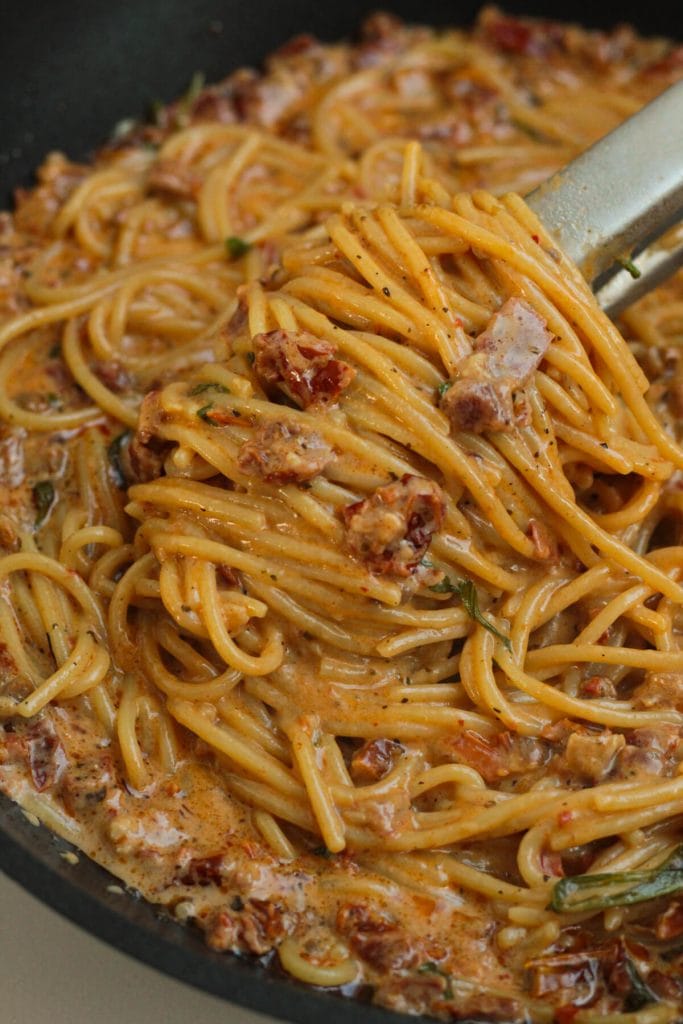 creamy sun-dried tomato sauce on a pan