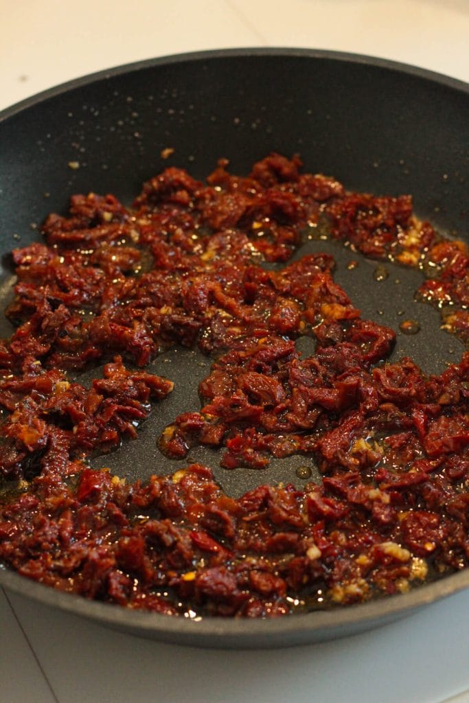 chopped sun-dried tomatoes on a pan