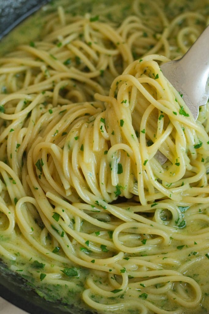 roasted garlic aglio e olio on a pan