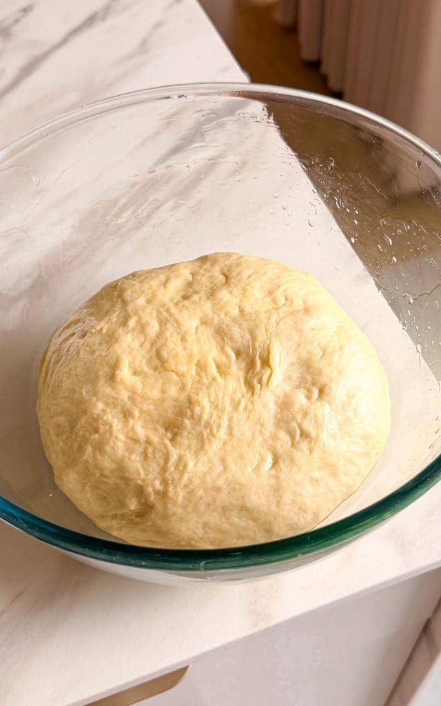 dough for garlic rolls in a large bowl