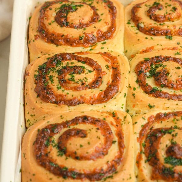 cheesy garlic rolls in a baking pan