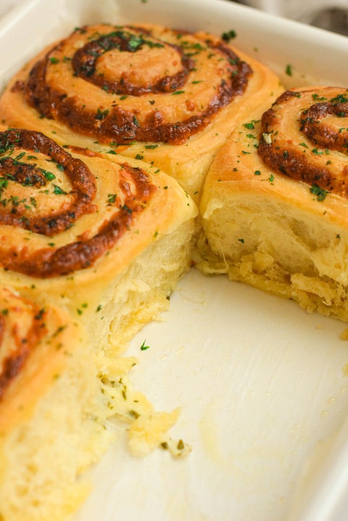 soft and cheesy garlic rolls in a baking pan