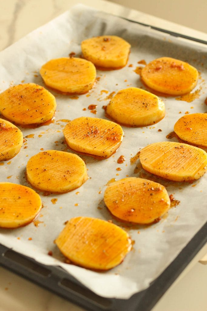 potato slices in a baking tray